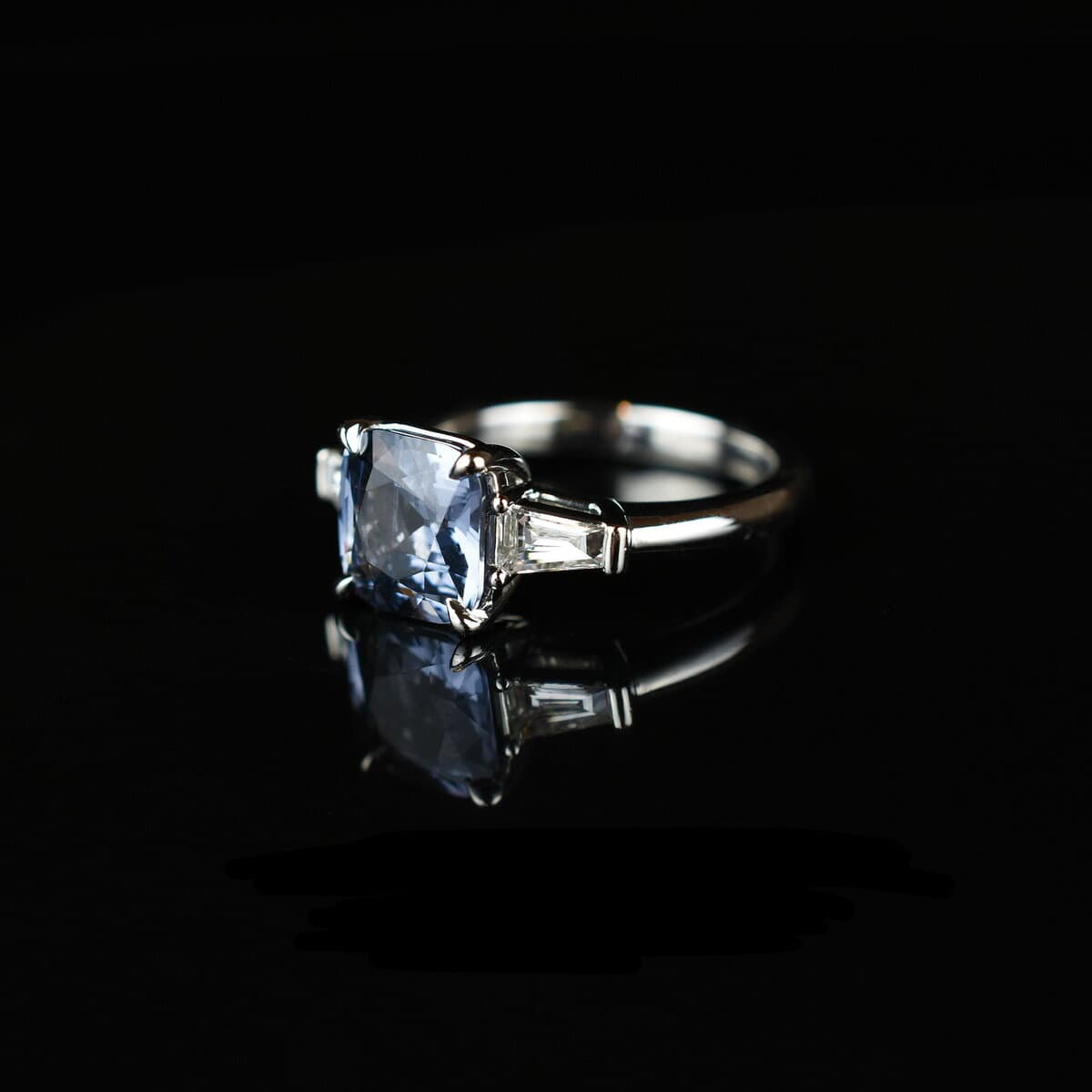 Blue sapphire ring with baguette diamond accents