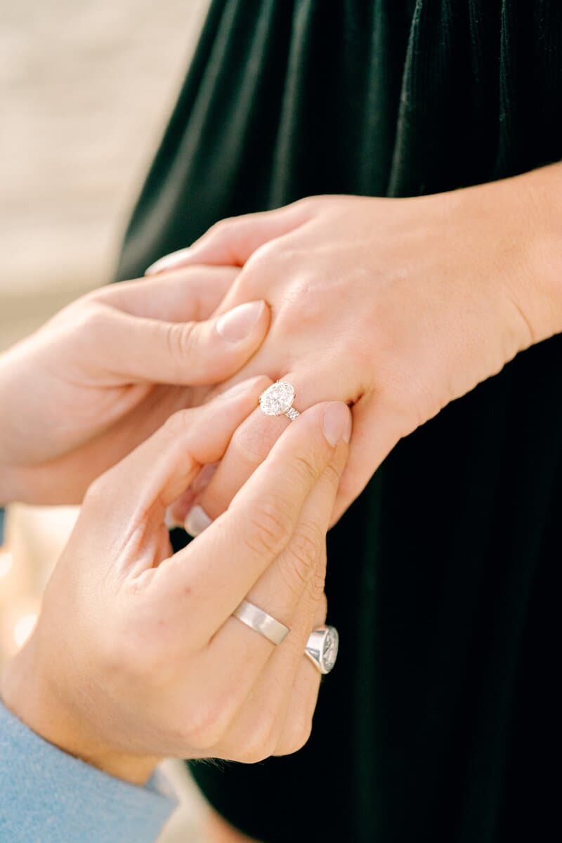 Engagement ring on couple's hands
